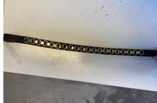 Bild av Brunt pannband med gulddetaljer