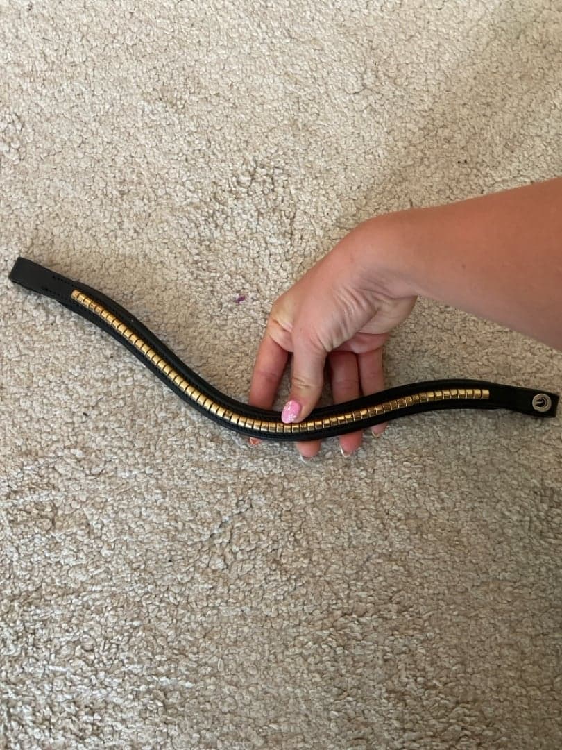 Image 1 of Svart pannband med guld detalj